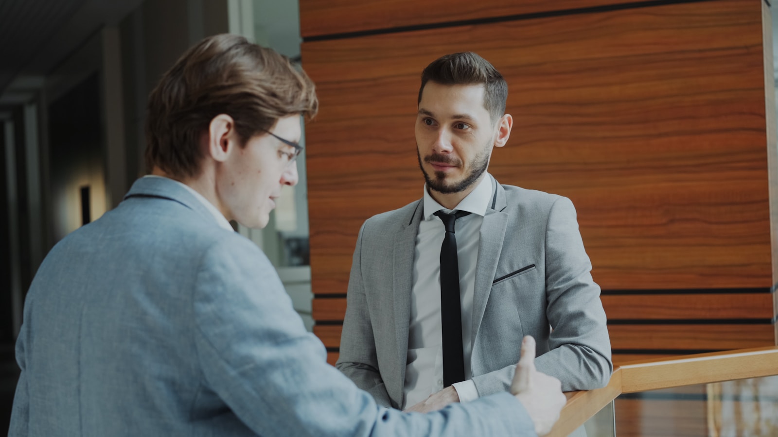 Business negotiation handshake in an office